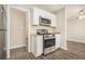 Bright and updated kitchen with stainless steel appliances and white cabinetry at 2254 Whites Mill Rd, Decatur, GA 30032