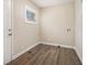 An entry room features wood-style floors, bright natural light from window, and utility hookups at 2254 Whites Mill Rd, Decatur, GA 30032
