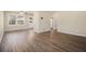 A brightly lit living room features new flooring, neutral paint, and bright natural light at 2254 Whites Mill Rd, Decatur, GA 30032