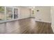 A spacious living room features new flooring, neutral paint, and bright natural light at 2254 Whites Mill Rd, Decatur, GA 30032