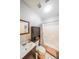 Bathroom featuring a single vanity, white toilet, and tub/shower with a decorative curtain at 4408 Meadowwood Dr, Loganville, GA 30052