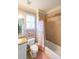 Bathroom featuring tile shower and granite vanity at 4408 Meadowwood Dr, Loganville, GA 30052