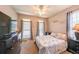Comfortable bedroom with neutral tones, TV, and natural light at 4408 Meadowwood Dr, Loganville, GA 30052