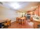Dining room features wood floors and a view into the kitchen at 4408 Meadowwood Dr, Loganville, GA 30052