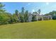 Well-manicured lawn and landscaped yard with home in the background at 4408 Meadowwood Dr, Loganville, GA 30052