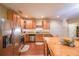 Spacious kitchen featuring stainless appliances and a view into the dining room at 4408 Meadowwood Dr, Loganville, GA 30052
