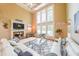 Bright living room featuring high ceilings, fireplace, and large windows for lots of natural light at 4408 Meadowwood Dr, Loganville, GA 30052