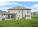 Large backyard featuring a covered patio with furniture and lush grass at 4826 Ralin Ct, Atlanta, GA 30331