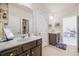 Bright bathroom featuring a vanity with a white countertop and dark brown cabinets at 4826 Ralin Ct, Atlanta, GA 30331