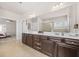 Spacious bathroom featuring a double sink vanity, neutral tile flooring, and ample lighting at 4826 Ralin Ct, Atlanta, GA 30331