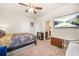 Comfortable bedroom with carpet floors, ceiling fan, and an en-suite bathroom at 4826 Ralin Ct, Atlanta, GA 30331
