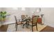 Charming dining area featuring a round table and four upholstered chairs on an elegant rug at 4826 Ralin Ct, Atlanta, GA 30331