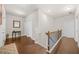 Bright hallway with hardwood floors, white walls, and a decorative table and mirror at 4826 Ralin Ct, Atlanta, GA 30331