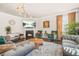 Stylish living room with cozy seating, a fireplace, and a modern lighting fixture at 4826 Ralin Ct, Atlanta, GA 30331