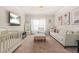 Cozy living room featuring a plush couch, neutral decor, and a wall-mounted television at 4826 Ralin Ct, Atlanta, GA 30331