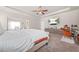 Large main bedroom with tray ceilings, a ceiling fan, and adjoining sitting area at 4826 Ralin Ct, Atlanta, GA 30331