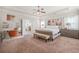 Bright and airy main bedroom with a sitting area, makeup vanity, and ample closet space at 4826 Ralin Ct, Atlanta, GA 30331