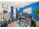 Office space featuring a work area, blue accent wall, and exercise equipment at 4826 Ralin Ct, Atlanta, GA 30331