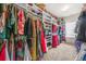 Large walk-in closet with ample shelving, hanging space, and carpet flooring at 4826 Ralin Ct, Atlanta, GA 30331