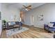 Inviting living room featuring a vaulted ceiling, hardwood floors, and a comfortable seating area at 1620 Rising Mist Ln, Cumming, GA 30041