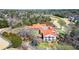 Aerial view of community clubhouse with golf course and pond creating an ideal leisure and recreational experience at 2758 Chieftain Run, Duluth, GA 30097