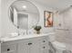 Modern bathroom with a marble vanity, a round mirror, and a glass-enclosed shower at 2758 Chieftain Run, Duluth, GA 30097