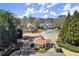 Welcoming gated entrance to a secure neighborhood with well-kept landscaping and charming architecture at 2758 Chieftain Run, Duluth, GA 30097