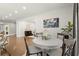 This dining area has hardwood floors, a view to the living room, and neutral decor at 2758 Chieftain Run, Duluth, GA 30097