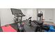 Home gym with a spin bike, weight-lifting equipment, and rubberized flooring at 2758 Chieftain Run, Duluth, GA 30097