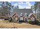 Elegant brick home with mature landscaping, bay window, and classic architectural details at 2758 Chieftain Run, Duluth, GA 30097