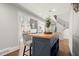 The blue kitchen island offers seating with light wood countertops, complemented by an open-concept living area at 2758 Chieftain Run, Duluth, GA 30097