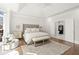 Bright and airy main bedroom with tray ceiling, sitting area, and ensuite bathroom at 2758 Chieftain Run, Duluth, GA 30097