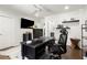 Well-lit home office featuring dark wood desk, modern decor, and a comfortable workspace at 2758 Chieftain Run, Duluth, GA 30097