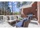 Inviting patio with a grill, ample seating, and view of the yard, perfect for outdoor dining and relaxation at 2758 Chieftain Run, Duluth, GA 30097