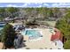 Aerial view of community pool, waterslide, and pergola covered seating area at 2758 Chieftain Run, Duluth, GA 30097