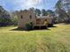 Expansive backyard featuring a wooden deck that leads to a home with neutral siding at 2917 High Brook Se Way, Conyers, GA 30094