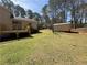 View of the expansive backyard, deck, and additional storage shed at 2917 High Brook Se Way, Conyers, GA 30094