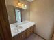 Bathroom featuring a single sink vanity, large mirror, and decorative lighting at 2917 High Brook Se Way, Conyers, GA 30094