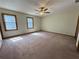 Spacious bedroom with two windows offering natural light and cozy carpet flooring at 2917 High Brook Se Way, Conyers, GA 30094