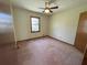 Cozy bedroom features neutral walls, carpet flooring, and a ceiling fan at 2917 High Brook Se Way, Conyers, GA 30094