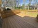 Wooden deck with a built-in bench, perfect for enjoying the outdoors at 2917 High Brook Se Way, Conyers, GA 30094