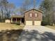 Brick front home with a well manicured lawn at 2917 High Brook Se Way, Conyers, GA 30094