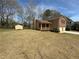 Home with a spacious front yard, storage shed, and two-car garage at 2917 High Brook Se Way, Conyers, GA 30094