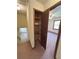 Hallway with a storage closet leading to a bedroom, featuring carpet floors at 2917 High Brook Se Way, Conyers, GA 30094