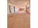 Large living room showcasing unfinished drywall and flooring in a new home at 4881 Powers Ferry Nw Rd, Atlanta, GA 30327