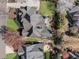 Aerial view of the house showing the roof, driveway and landscaped yard at 700 Clubside Dr, Roswell, GA 30076