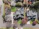 Aerial view of the house showing the roof, driveway and landscaped yard at 700 Clubside Dr, Roswell, GA 30076