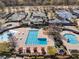 Stunning aerial view of the community clubhouse, pools, splash pad, and tennis courts at 700 Clubside Dr, Roswell, GA 30076