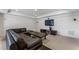 Finished basement offering a large sectional, a TV, and ample space for recreation at 700 Clubside Dr, Roswell, GA 30076