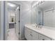 Bright bathroom with a long countertop, white cabinets and light blue walls at 700 Clubside Dr, Roswell, GA 30076